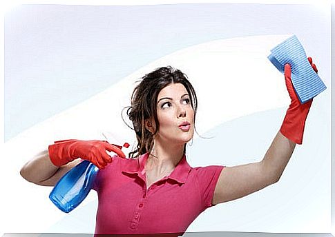 Woman cleaning a glass