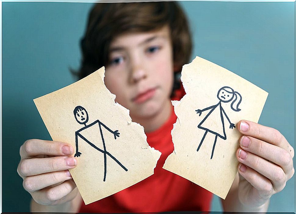 Child with a drawn and broken couple