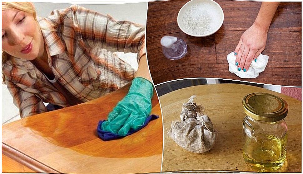 Woman varnishing and cleaning a table.