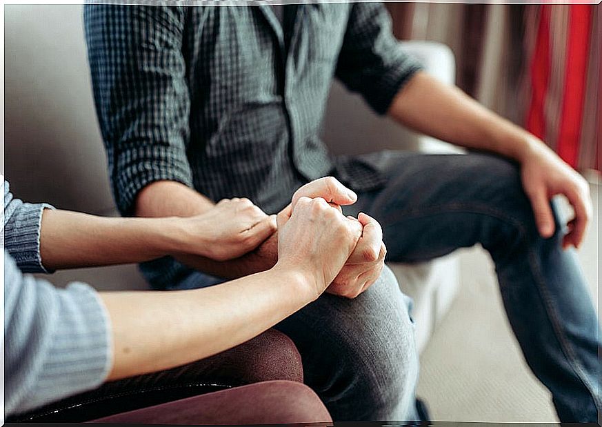 Couple in therapy holding hands: setting boundaries