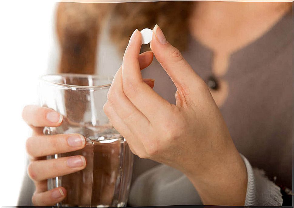 woman taking pill